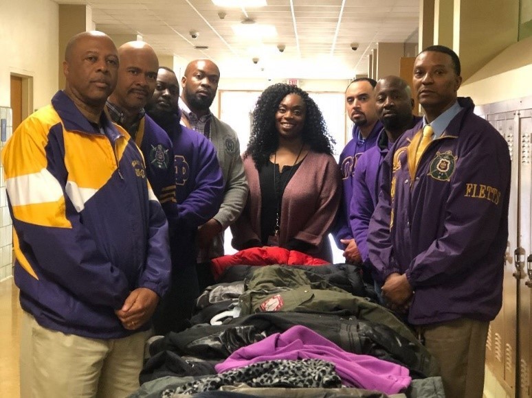 Psi Upsilon Donates Coats To Local High School Students.
